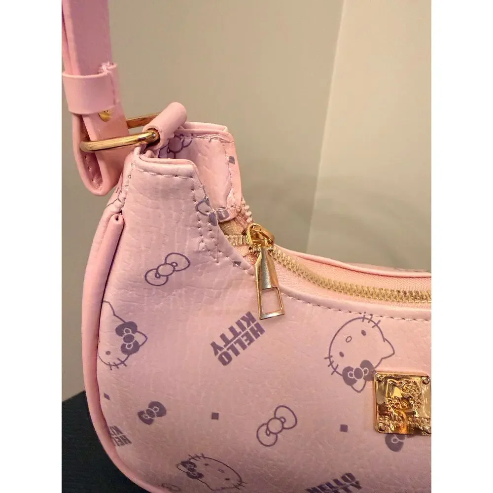 Hello Kitty Pink monogram crescent shoulder bag, all-over character print.